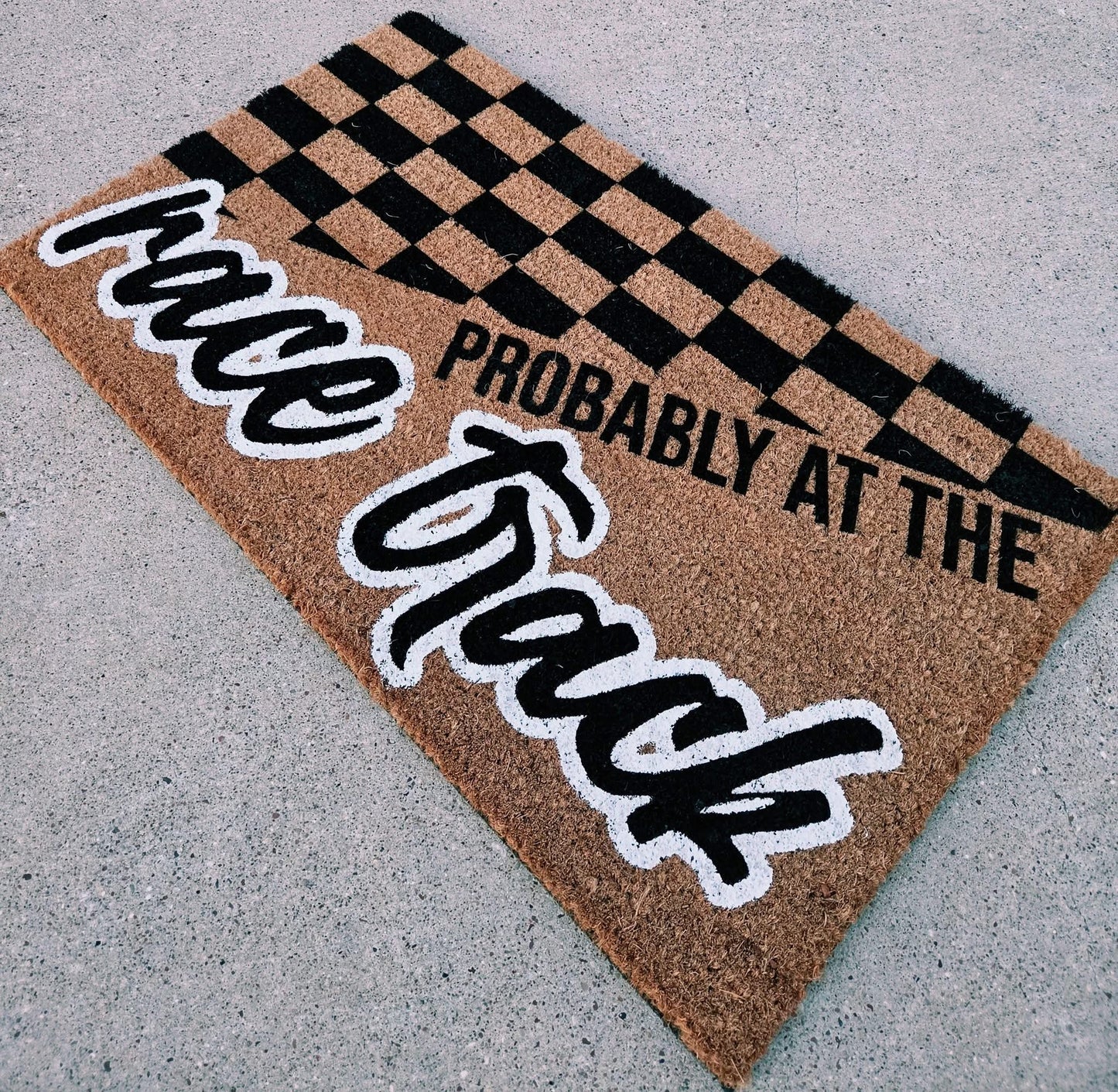 Probably at the race track door mat