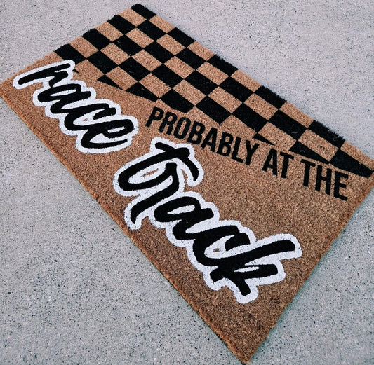 Probably at the race track door mat